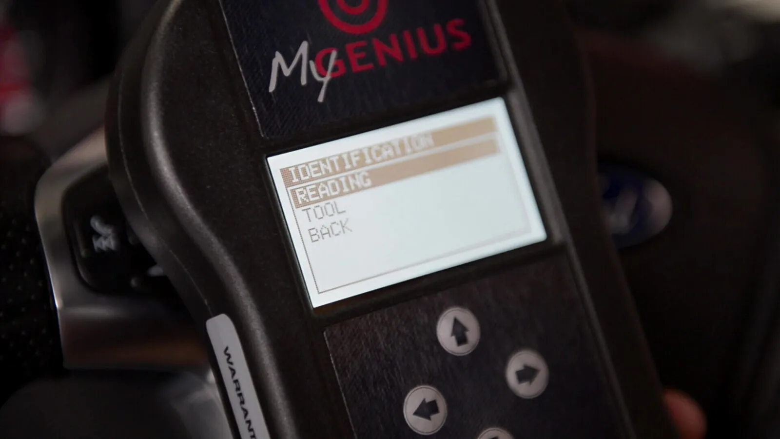 MyGenius in hand, showing its menu screen